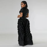 Woman wearing BWQ Fashion 2024 Ruffled Wide Leg Jumpsuit in black, showcasing streetwear style with ruffles and wide leg design.