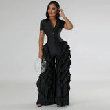 Woman wearing BWQ Fashion 2024 Ruffled Wide Leg Jumpsuit in black, holding a clear handbag, showcasing streetwear style.