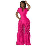 Woman wearing a bright pink BWQ Fashion 2024 ruffled wide-leg jumpsuit, showcasing summer streetwear style.