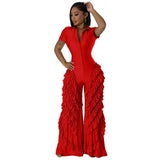 Woman wearing BWQ Fashion 2024 ruffled wide-leg jumpsuit in red, showcasing summer streetwear vibes with high-waisted fit and stylish design.